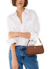 on-model-Kate-Spade-Kayla-Pebbled-Leather-Convertible-Wristlet-Brown
