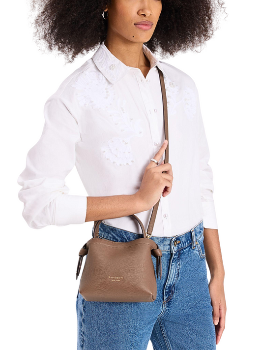 on-model-Kate-Spade-Knott-Mini-Crossbody-Pebbled-Leather-Warm-Accorn