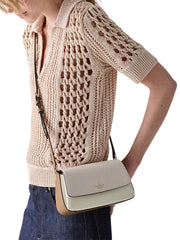 on-model-Kate-Spade-Sutton-Mini-Flap-Crossbody-Bag-Powdered-Sugar-Multi