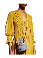 on-model-Tory-Burch-T-Monogram-Patent-Embossed-Mini-Bucket-Bag-Dark-LotusWEBP