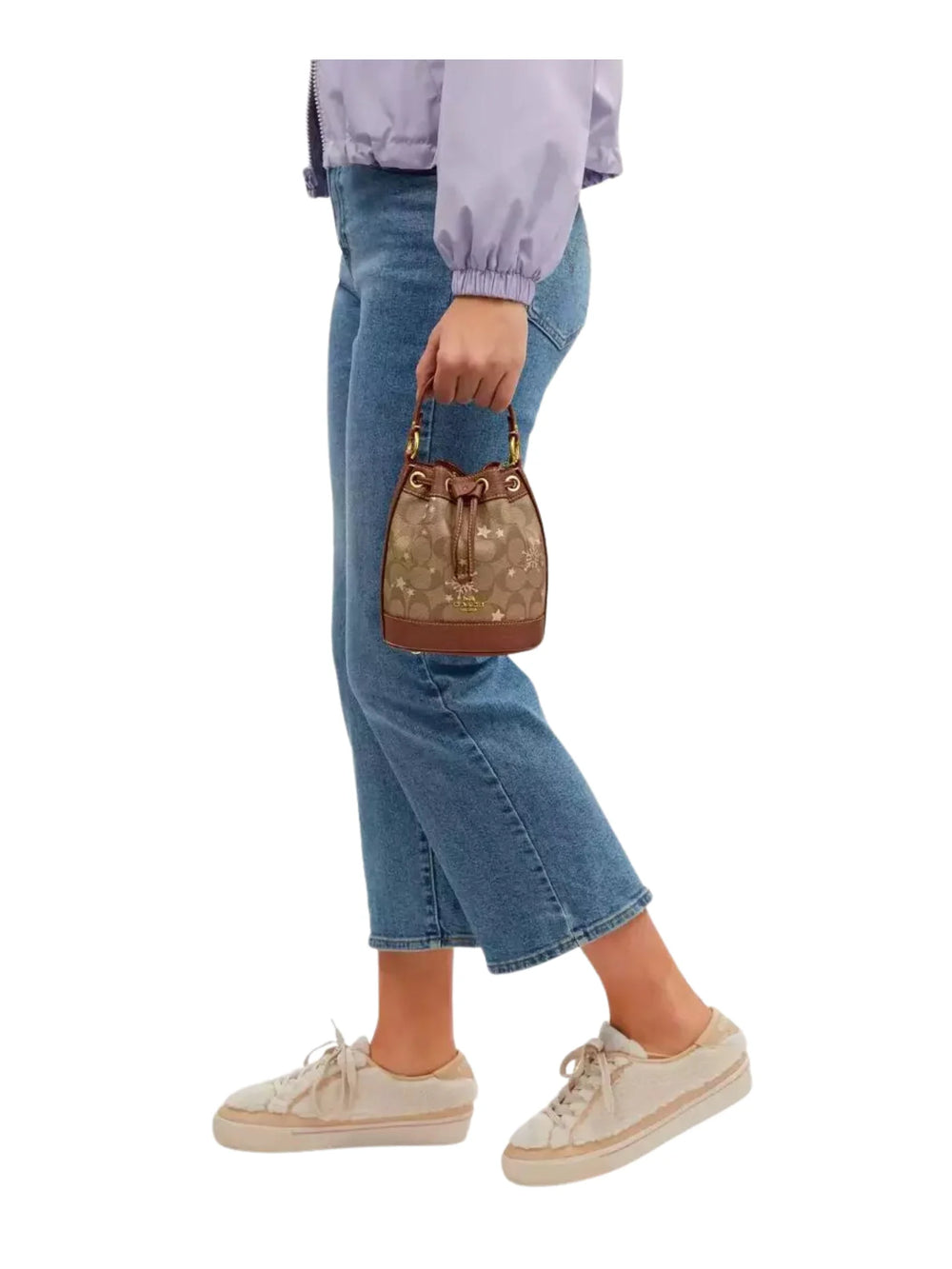 on-model1-Coach-Dempsey-Drawstring-Bucket-Bag-15-In-Signature-Canvas-With-Snowflake-and-stars-Print-Khaki-MultiWEBP