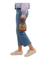 on-model1-Coach-Dempsey-Drawstring-Bucket-Bag-15-In-Signature-Canvas-With-Snowflake-and-stars-Print-Khaki-MultiWEBP