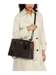 on-model1-Coach-Tatum-Carryall-In-Signature-Canvas-Brown-BlackWEBP