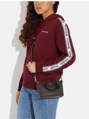 on-model2-Coach-Gallery-Mini-crossbody-brown-black