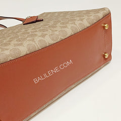 Coach 31210 Charlie Carryall In Signature Canvas Rust