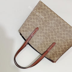 Coach 31210 Charlie Carryall In Signature Canvas Rust