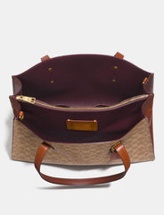 Coach 31210 Charlie Carryall In Signature Canvas Rust