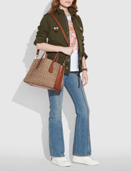 Coach 31210 Charlie Carryall In Signature Canvas Rust
