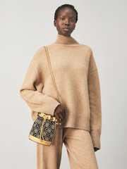 Tory-Burch-88780-T-Monogram-Mini-Chenille-Bucket-Bag-Black-Cream-Balilene-onmodel