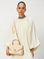 Tory-Burch-Kira-Small-Top-Handle-Satchel-Bag-Brie-Rolled-Gold-Balilene-onmodel