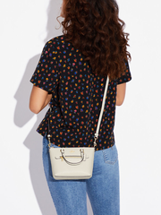 on-model-Coach-Mini-Gallery-Crossbody-Bag-Chalk