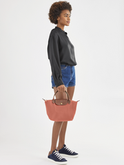 on-model-Longchamp-Le-Pliage-Original-Top-Handle-Bag-Small-Blush