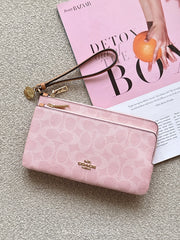 Coach-Double-Zip-Wallet-In-Signature-Canvas-With-Charms-Powder-Pink-balilene