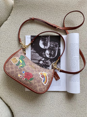 Coach-Teri-Shoulder-Bag-In-Signature-Canvas-With-Sticker-Print-Gold-Tan-Multi-balilene