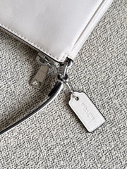 detail-Coach-Nolita-19-Debossed-Chalk-balilene
