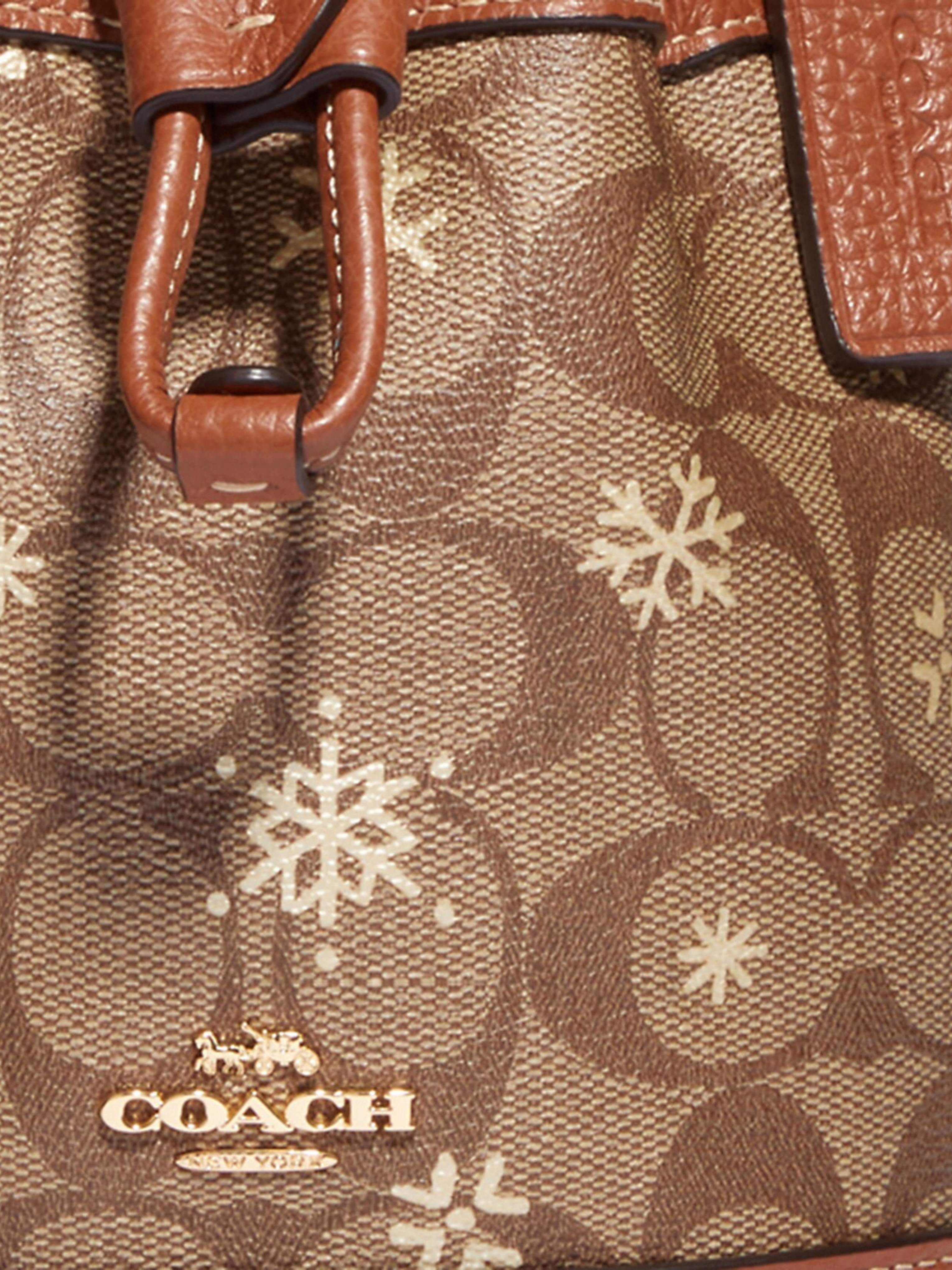 detail-Coach- Dempsey-Drawstring- Bucket -Bag -15 -In- Signature -Canvas -With- Snowflake Print -Khaki -Multi