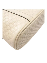 detail-bawah-Gucci-Alma-Small-GG-Guccissima-Camelia-Ivory