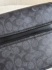detail-depan-Coach-Sullivan-Flap-Crossbody-Bag-In-Signature-Canvas-Charcoal-Black