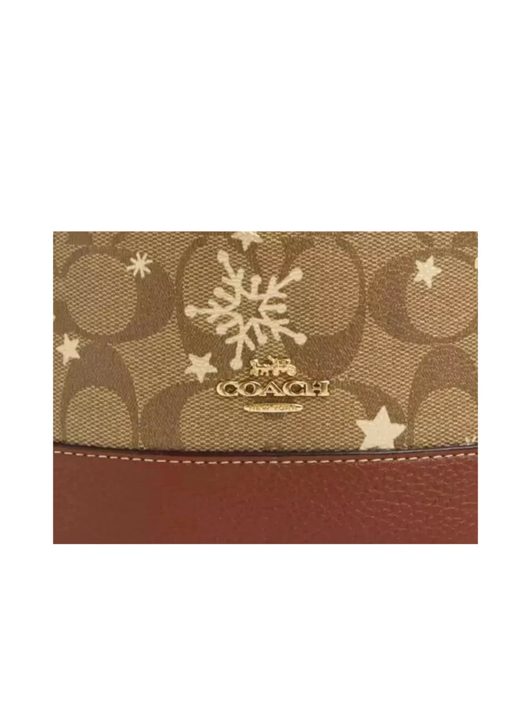 detail-logo-Coach-Dempsey-Drawstring-Bucket-Bag-15-In-Signature-Canvas-With-Snowflake-and-stars-Print-Khaki-MultiWEBP