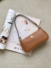 gambar-depan-Kate-Spade-Kayla-Pebbled-Leather-Convertible-Wristlet-Brown-balilene