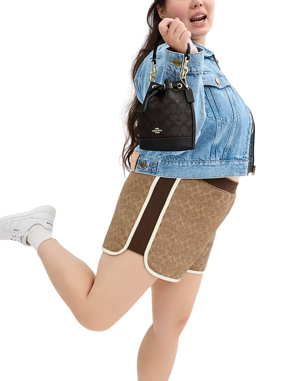 on-model-1-Coach-Mini-Bucket-Bag-In-Signature-Canvas-Walnut-Black