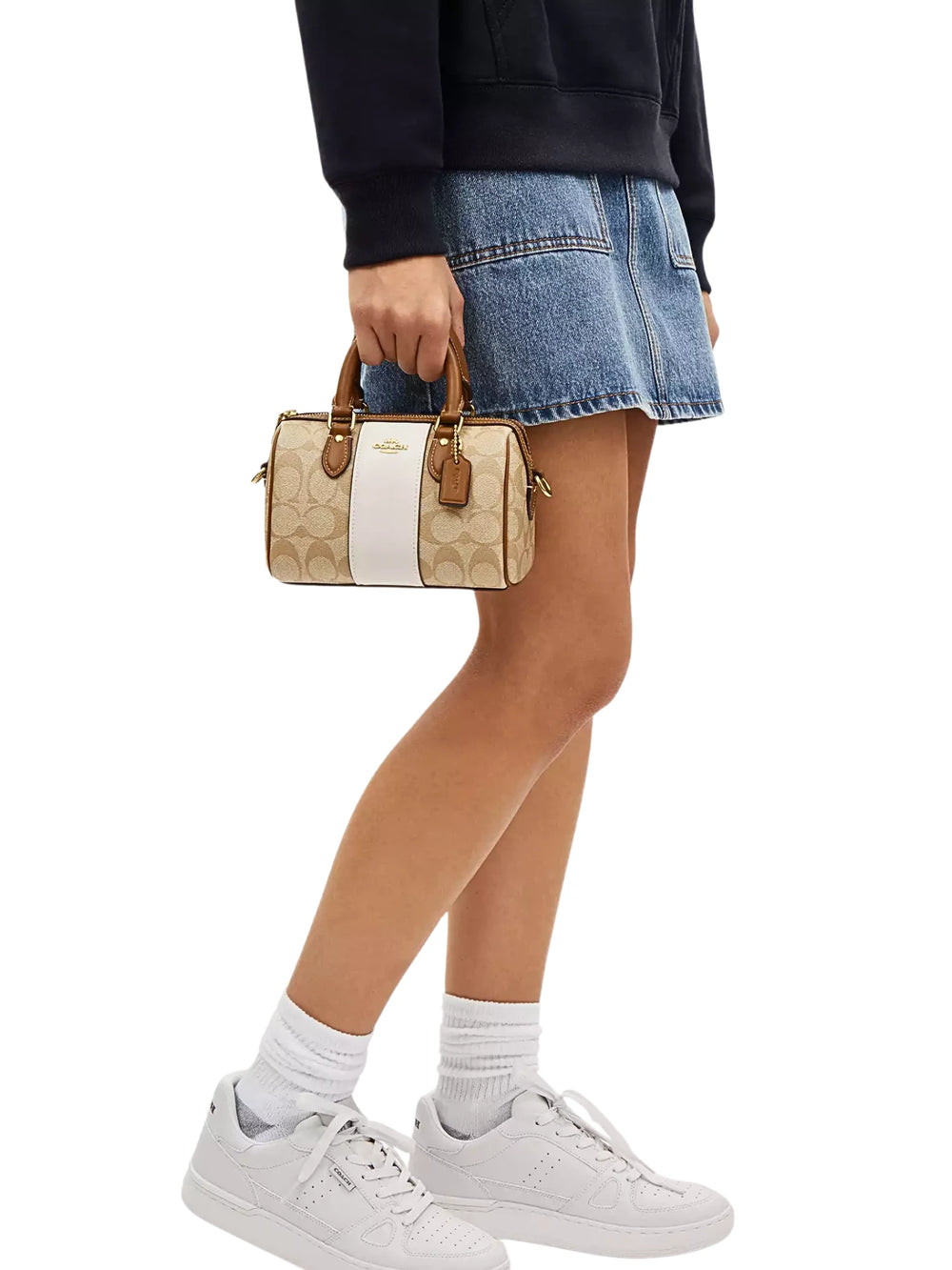 on-model-1-Coach-Mini-Rowan-Crossbody-In-Signature-Canvas-With-Stripe-Light-Khaki-Chalk-Saddle