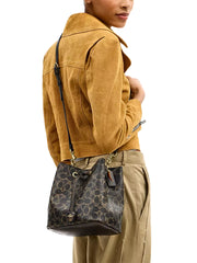 on-model-1-Coach-Rowan-Bucket-Bag-In-Loved-Signature-Canvas-With-Charms-Brown