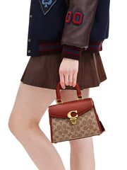 on-model-1-Coach-Sammy-Top-Handle-21-In-Signature-Canvas-Tan-Rust