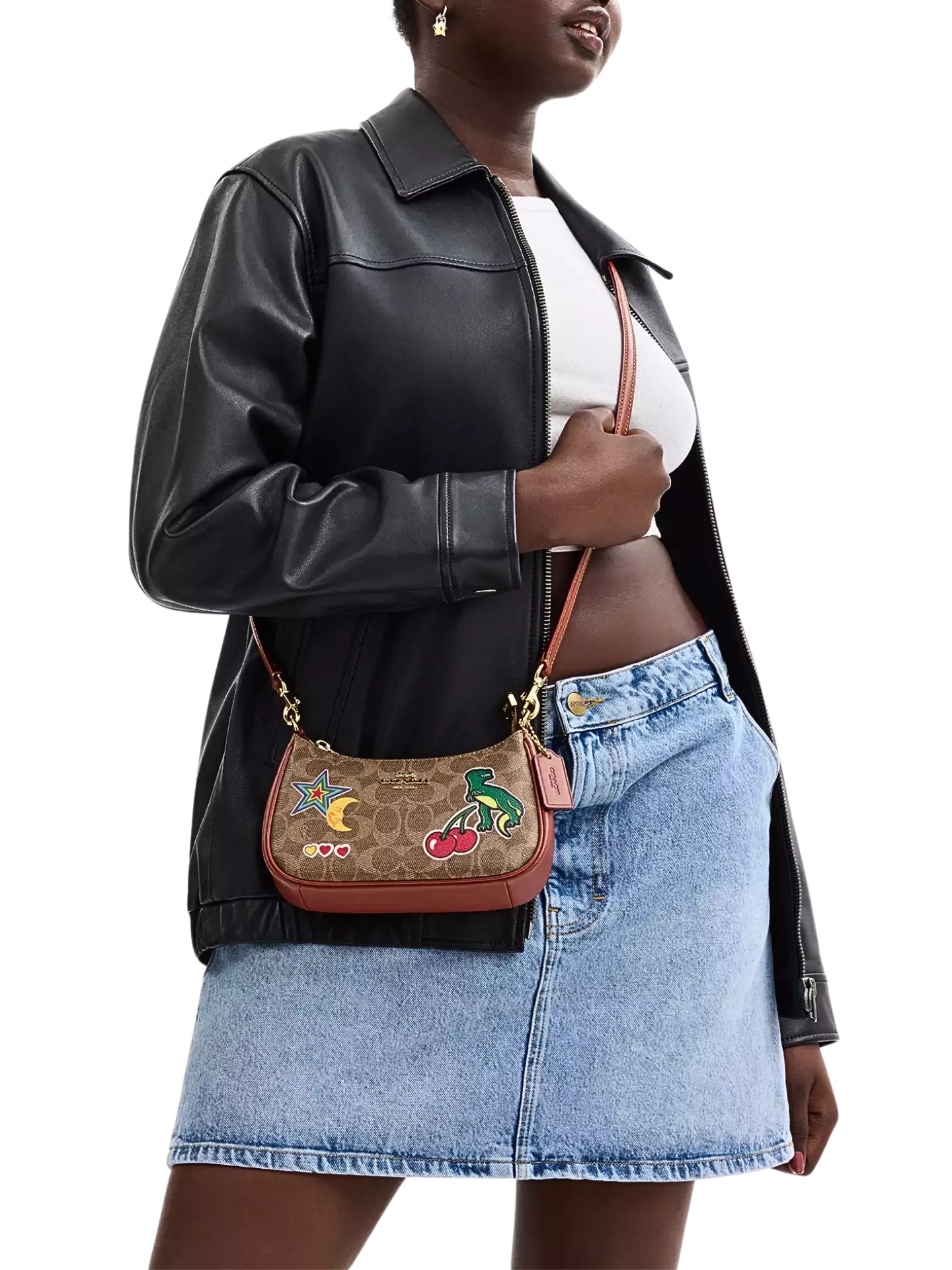 on-model-1-shoulder-Coach-Teri-Mini-Crossbody-Bag-In-Signature-Canvas-With-Sticker-Print-Tan-Multi