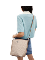 on-model-2-Coach-City-Large-Bucket-Bag-In-Signature-Canvas-Sand-Taupe