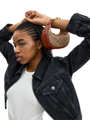 on-model-2-Coach-Jonie-Bag-In-Signature-Canvas-Tan-Rust