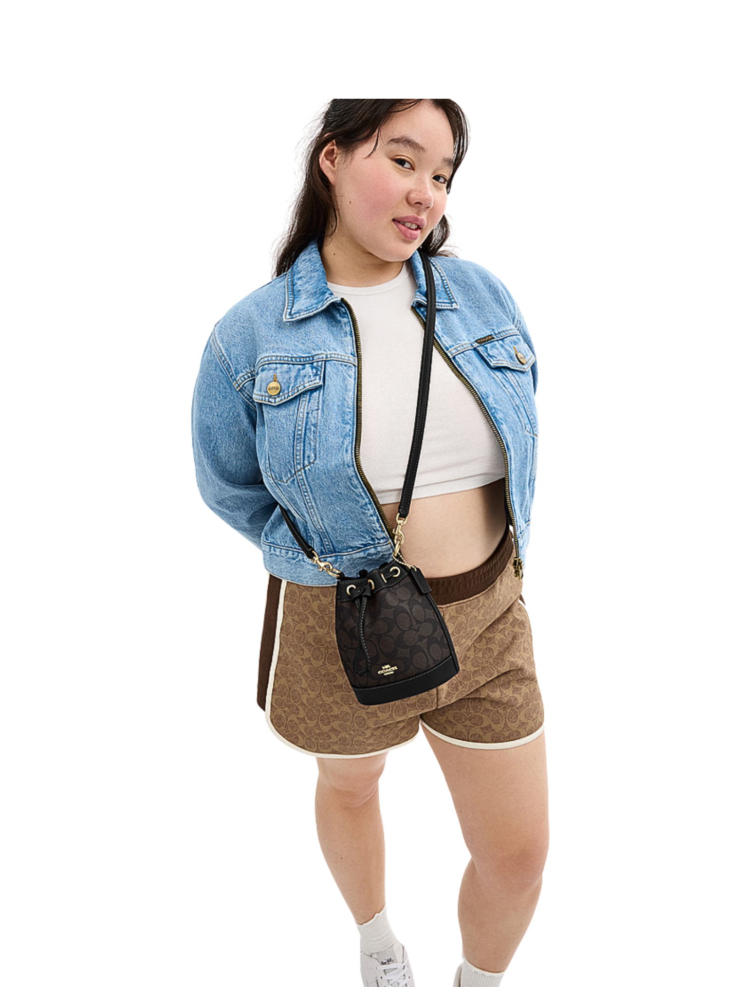 on-model-2-Coach-Mini-Bucket-Bag-In-Signature-Canvas-Walnut-Black