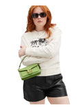 on-model-2-Coach-Tabby-20-Shoulder-Bag-in-Signature-Patent-Leather-Green