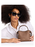 on-model-2-Kate-Spade-Knott-Mini-Crossbody-Pebbled-Leather-Warm-Accorn