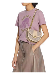 on-model-Coach-Alie-Saddle-Bag-In-Signature-Jacquard-Stone-IvoryWEBP