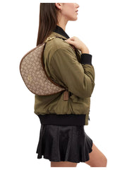 on-model-Coach-Aria-Shoulder-Bag-In-Signature-Jacquard-Khaki-Saddle-Multi