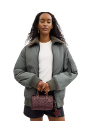 on-model-Coach-Boxed-Mini-Rowan-Crossbody-Bag-And-Mirror-Bag-Charm-Set-In-Signature-Canvas-Wine-Multi