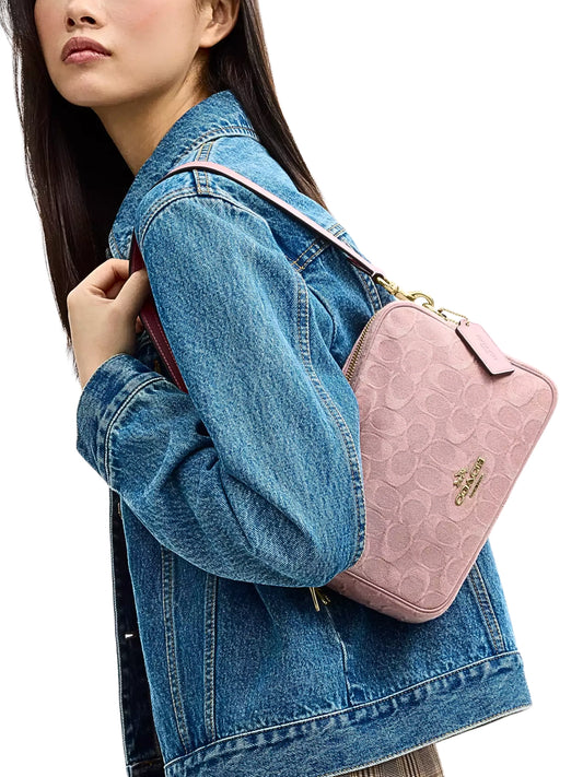 on-model-Coach-Carey-Crossbody-Bag-In-Signature-Denim-Light-Pink