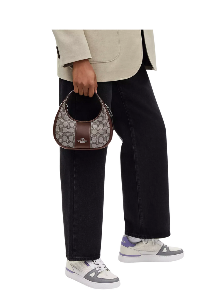 on-model-Coach-Carmen-Mini-Crossbody-In-Signature-Jacquard-Oak-Maple