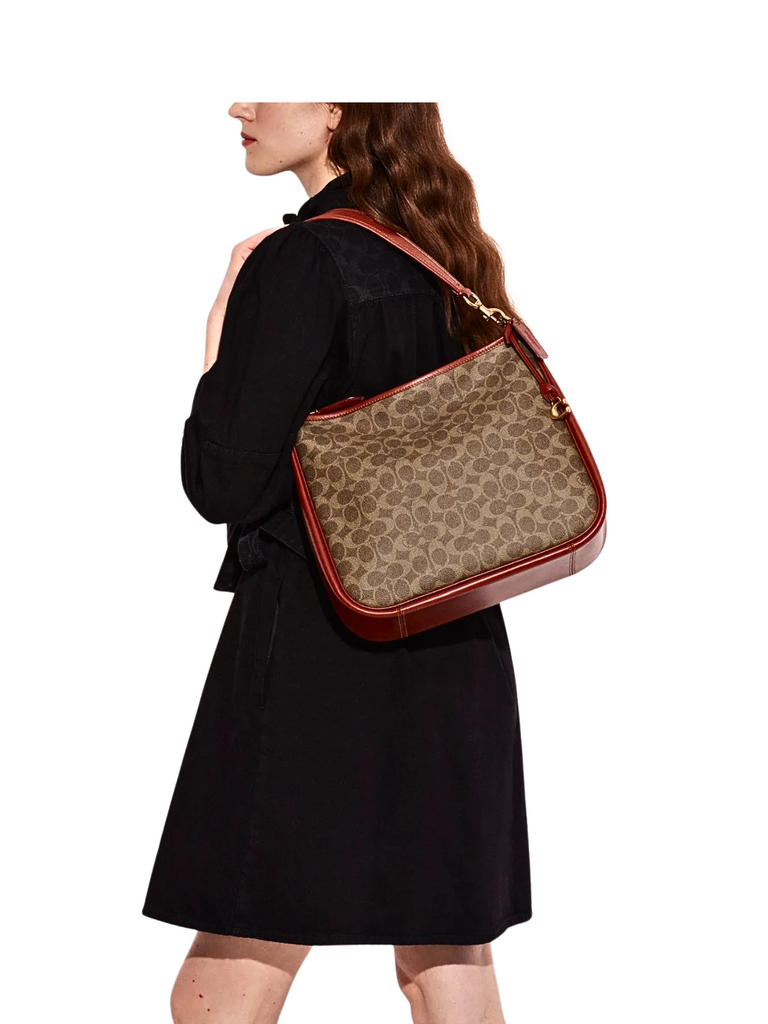 on-model-Coach-Cary-Shoulder-Bag-In-Signature-Canvas-Tan-Rust