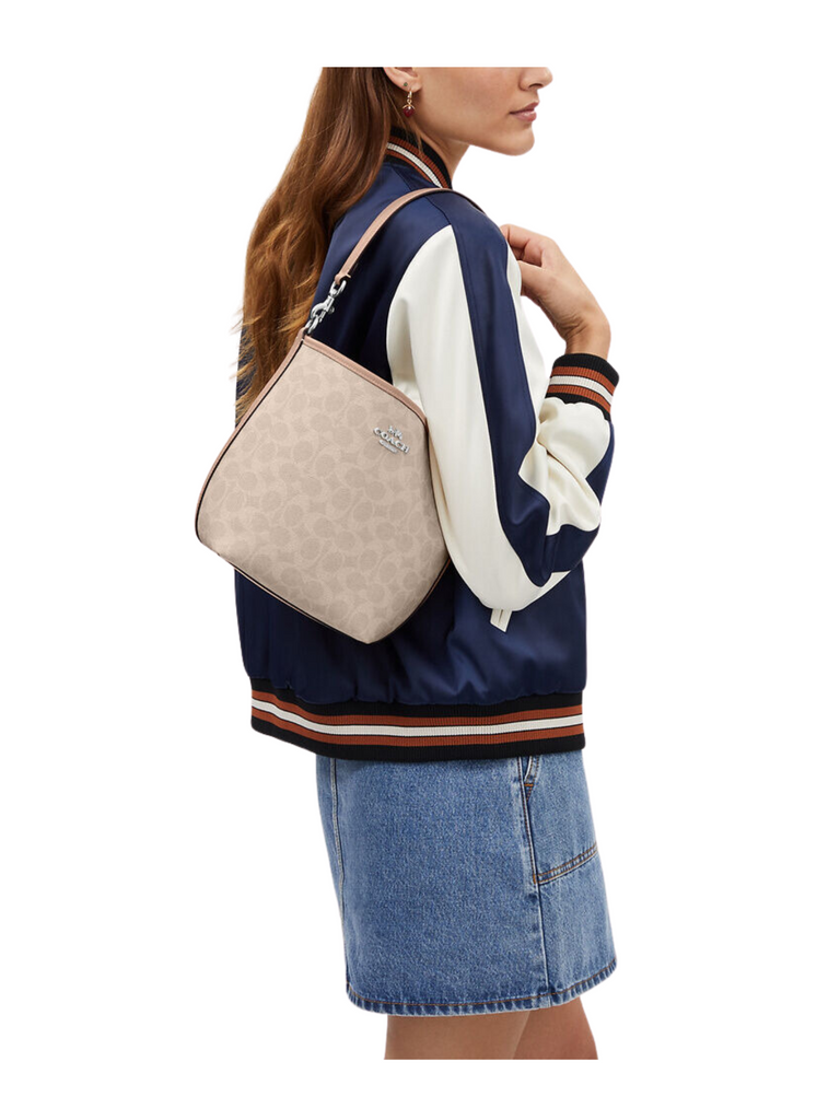 on-model-Coach-City-Bucket-Bag-In-Signature-Canvas-Sand-Taupe