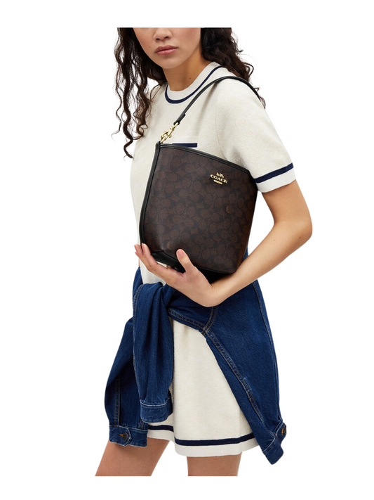 on-model-Coach-City-Bucket-Bag-In-Signature-Canvas-Walnut-Black