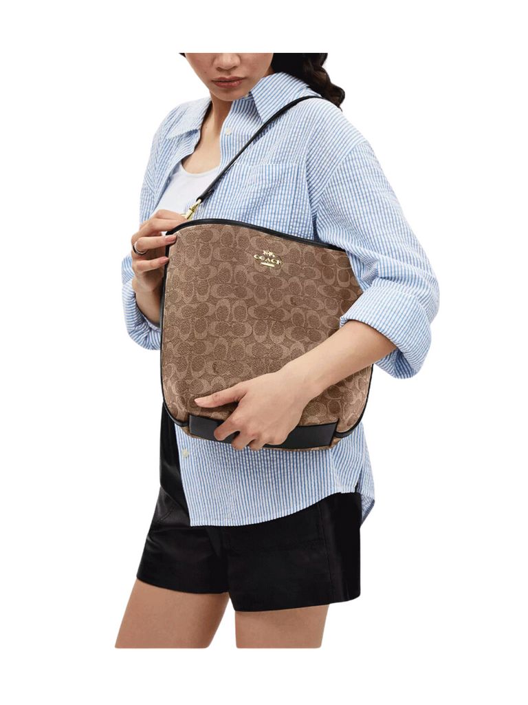 on-model-Coach-City-Large-Bucket-Bag-In-Signature-Canvas-Tan-Black