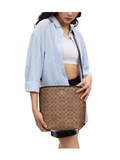 on-model-Coach-City-Large-Bucket-Bag-In-Signature-Canvas-Tan-Black