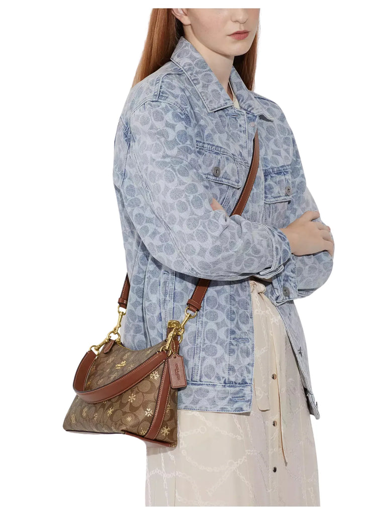 on-model-Coach-Clara-Shoulder-Bag-In-Signature-Canvas-With-Snowflike-Print