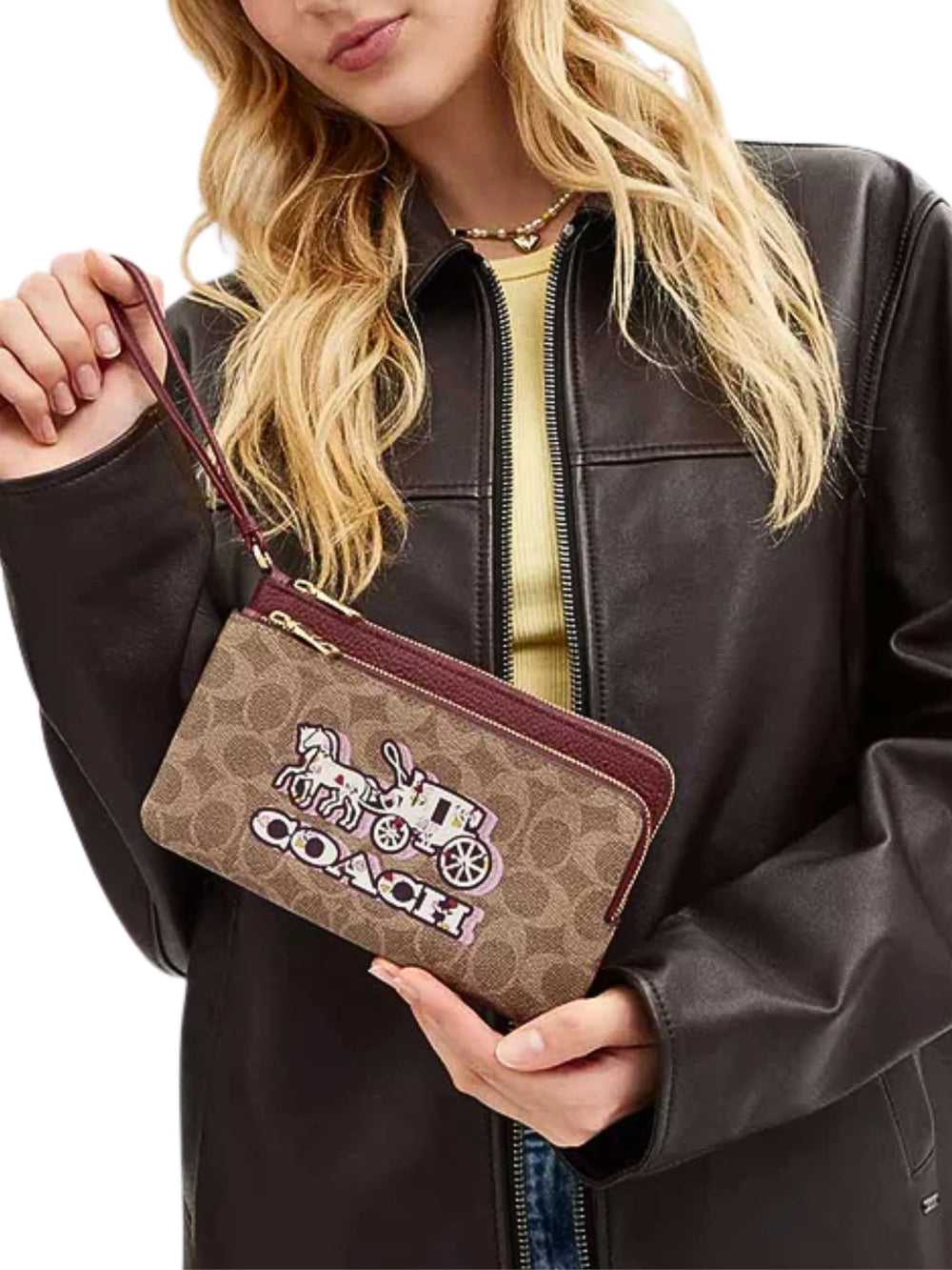 on-model-Coach-Double-Zip-Wallet-In-Signature-Canvas-With-Horse-And-Carriage-Print-Tan-Black-Cherry