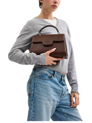 on-model-Coach-Eliza-Top-Handle-Bag-Maple