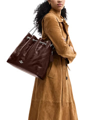 on-model-Coach-Evelyn-Large-Shoulder-Bag-With-Quilting-Maple