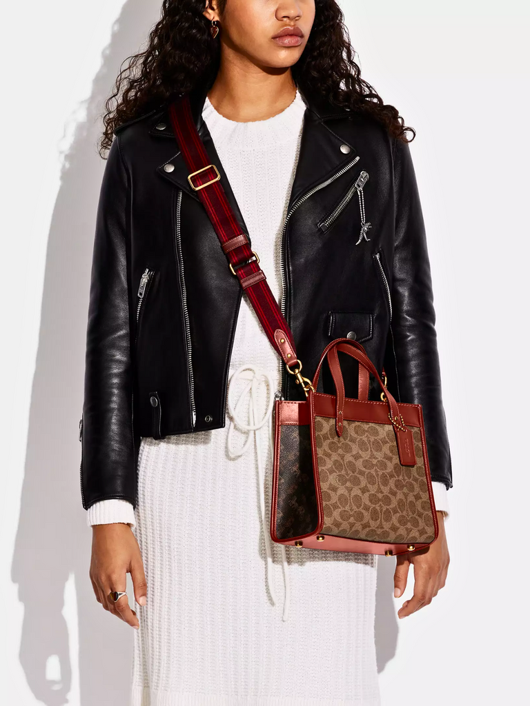 on-model-Coach-Field-Tote-22-In-Signature-Canvas-With-Horse-And-Carriage-Print-Tan-Truffle