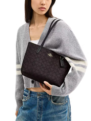 on-model-Coach-Fiona-Zip-Tote-Bag-In-Signature-Canvas-Walnut-Black